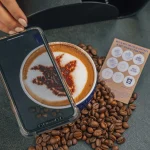 A cup of coffee with coffee beans at Kaldi 850